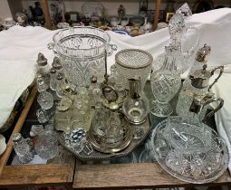 A large cut glass wine cooler together with crystal claret jugs, decanter stoppers,