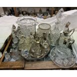 A large cut glass wine cooler together with crystal claret jugs, decanter stoppers,