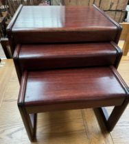 A mahogany nest of three tables