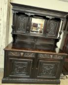 A 19th century Low Countries carved oak mirrorback sideboard,