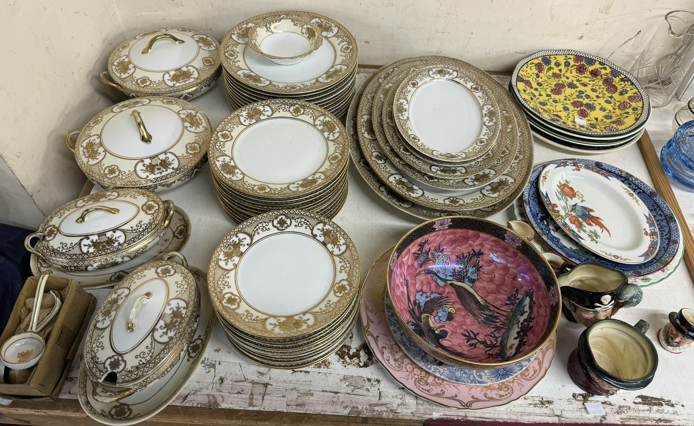 A Noritake part dinner service together with a Maling pottery bowl, pottery plates,