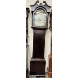 A 19th century longcase clock, the hood with a broken swan neck pediment above a long trunk door,