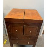 A 19th century mahogany Gentleman's washstand with a rise and fall mirror, fold over top,