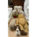 A wooden toy depicting two rabbits sawing together with an automaton dog, a teddy bear,