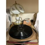 A table lamp together with records etc