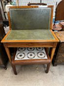 A reproduction yew card table with a foldover top square tapering legs together with a tiled top