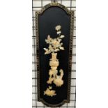 A Japanese lacquer and mother of pearl panel depicting a still life study of a vase of flowers