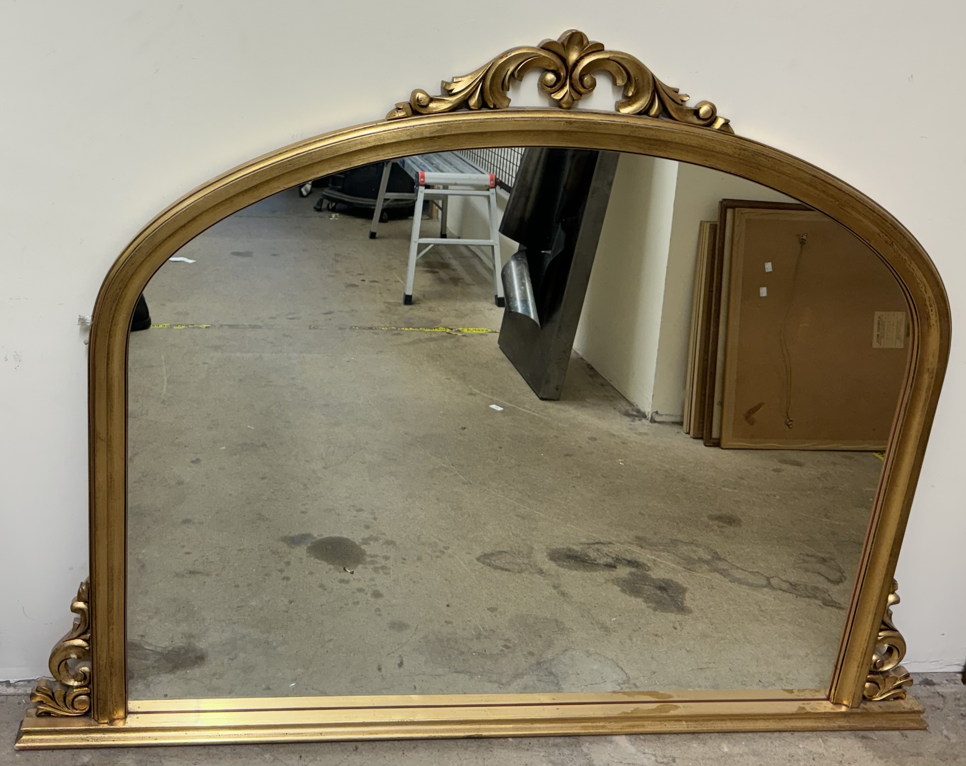 A Victorian style gilt framed overmantle wall mirror