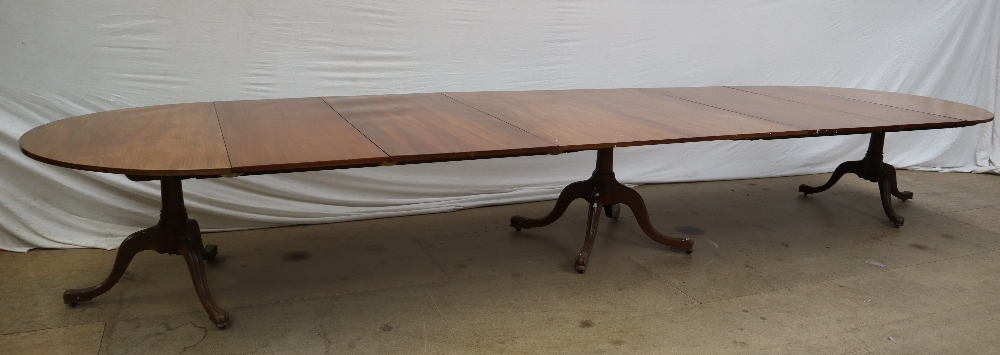 An early 19th century mahogany triple pedestal dining table in the manner of Gillows with a pair of - Image 12 of 15