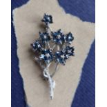 A sapphire and diamond brooch, of floral design,