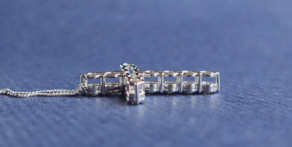 A diamond crucifix set with eleven round brilliant cut diamonds totalling approximately 2.41cts. - Image 4 of 5