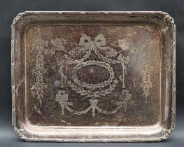 A George V silver dressing table tray of rectangular form with a line and bow border,
