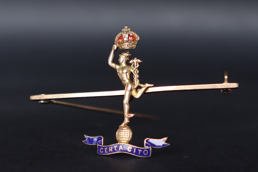 A 9ct gold Sweetheart brooch for the Royal Signal Corps depicting Mercury holding a crown,