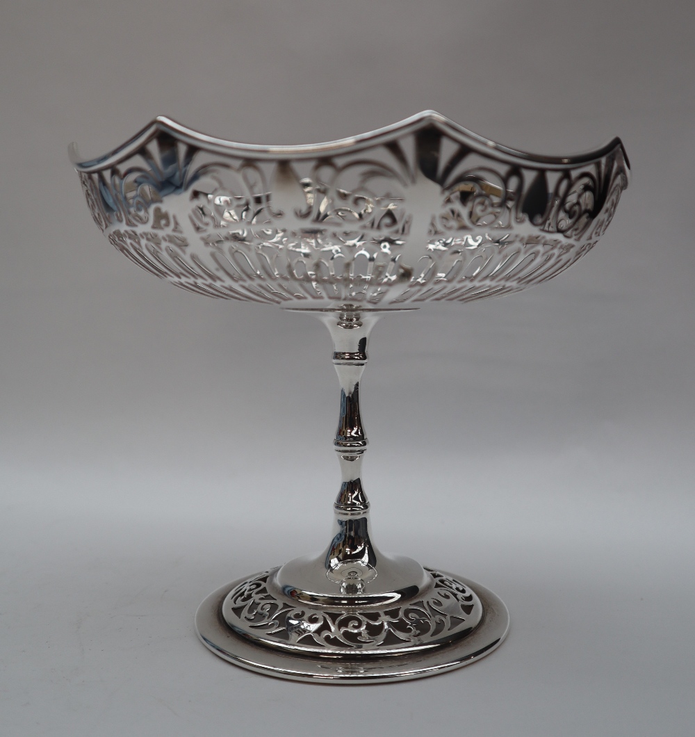 A George V silver pedestal bowl with a pierced pointed circular bowl on a ring turned column and