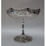 A George V silver pedestal bowl with a pierced pointed circular bowl on a ring turned column and