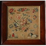 A Victorian sampler with a central bouquet of flowers, a figure and dog by Elizabeth Preston,