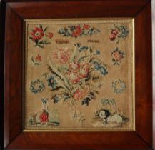 A Victorian sampler with a central bouquet of flowers, a figure and dog by Elizabeth Preston,