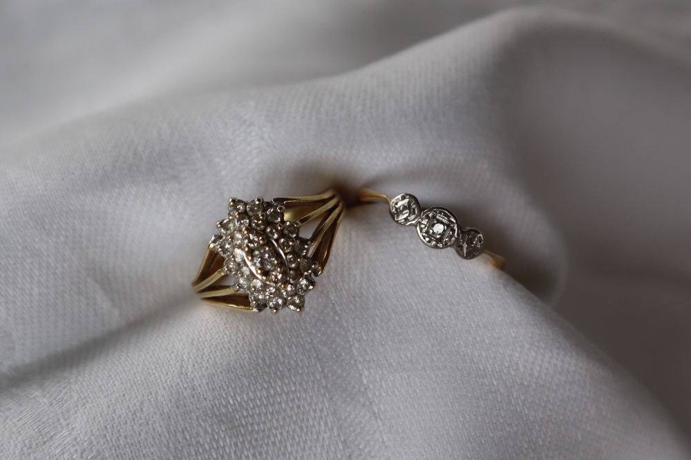 A diamond cluster ring,