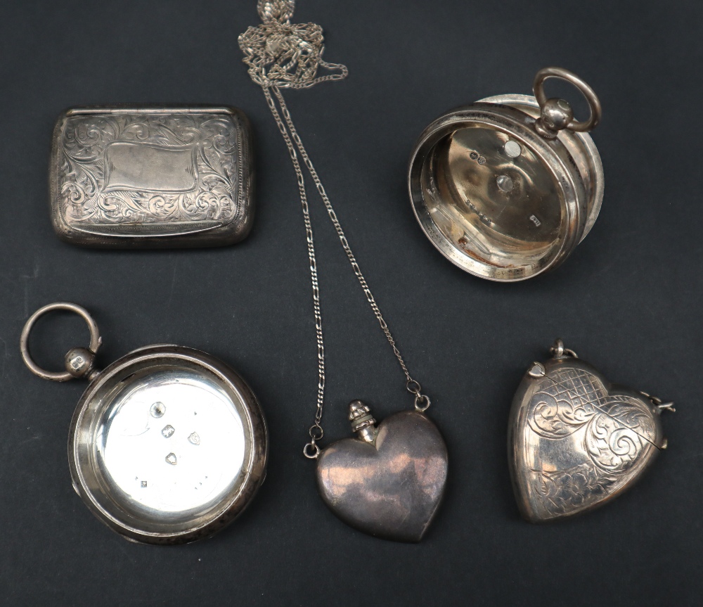Two silver watch cases together with a silver pill box,