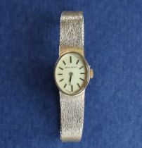 A lady's 9ct gold Jean Renet wristwatch, the oval dial with batons, with integral 9ct gold strap,