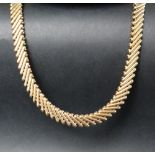 A 9ct yellow gold necklace with slanted bar links and a tongue and clip clasp, 44cm long,