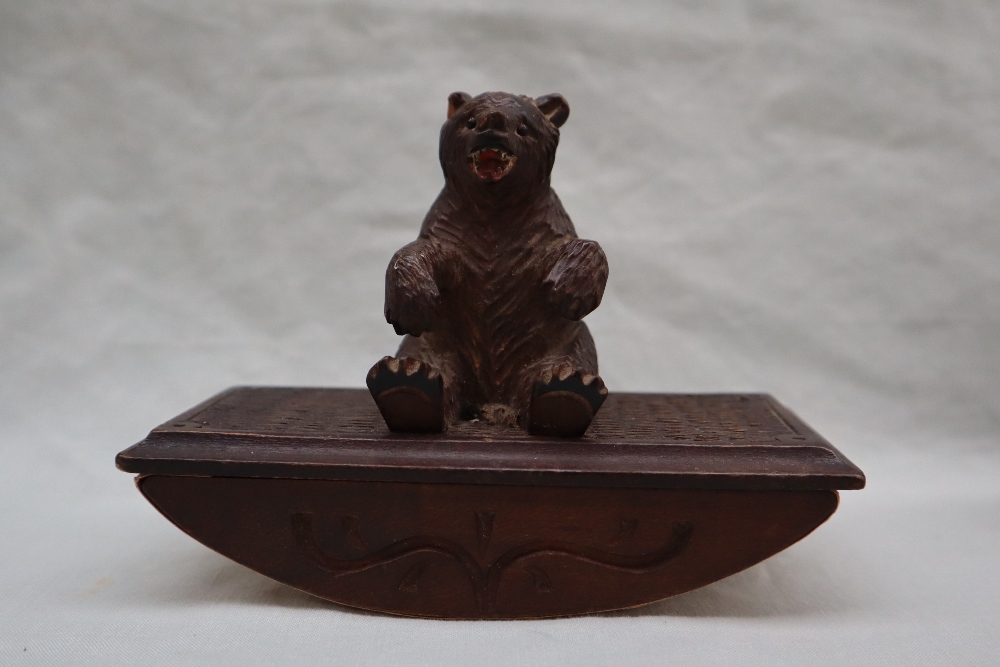 A Black Forest carved bear ink blotter,