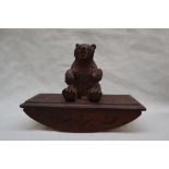 A Black Forest carved bear ink blotter,