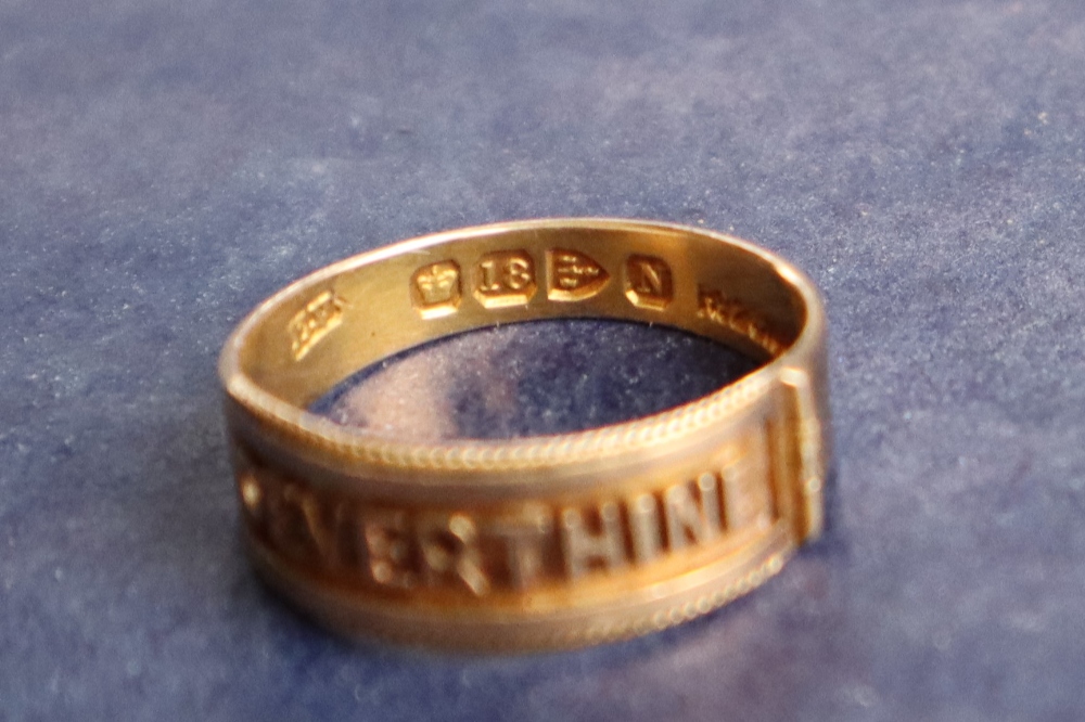 An 18ct gold ring with legend "OEVERTHINE", size N, approximately 2. - Image 2 of 3