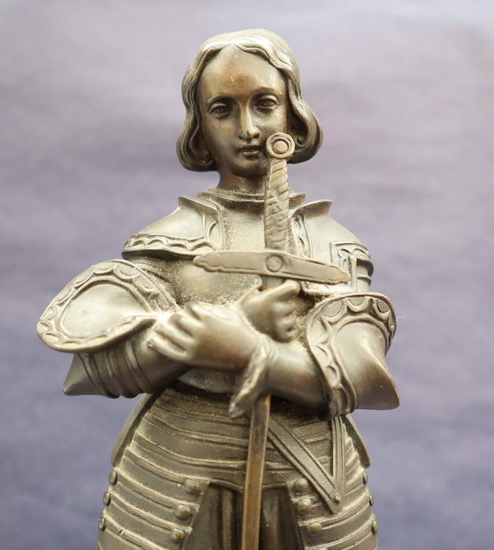 A bronze figure of Joan of Arc, with head bowed clutching a sword, on a circular marble base, 27. - Image 6 of 8