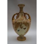 A Royal Worcester twin handled vase with a flared rim,