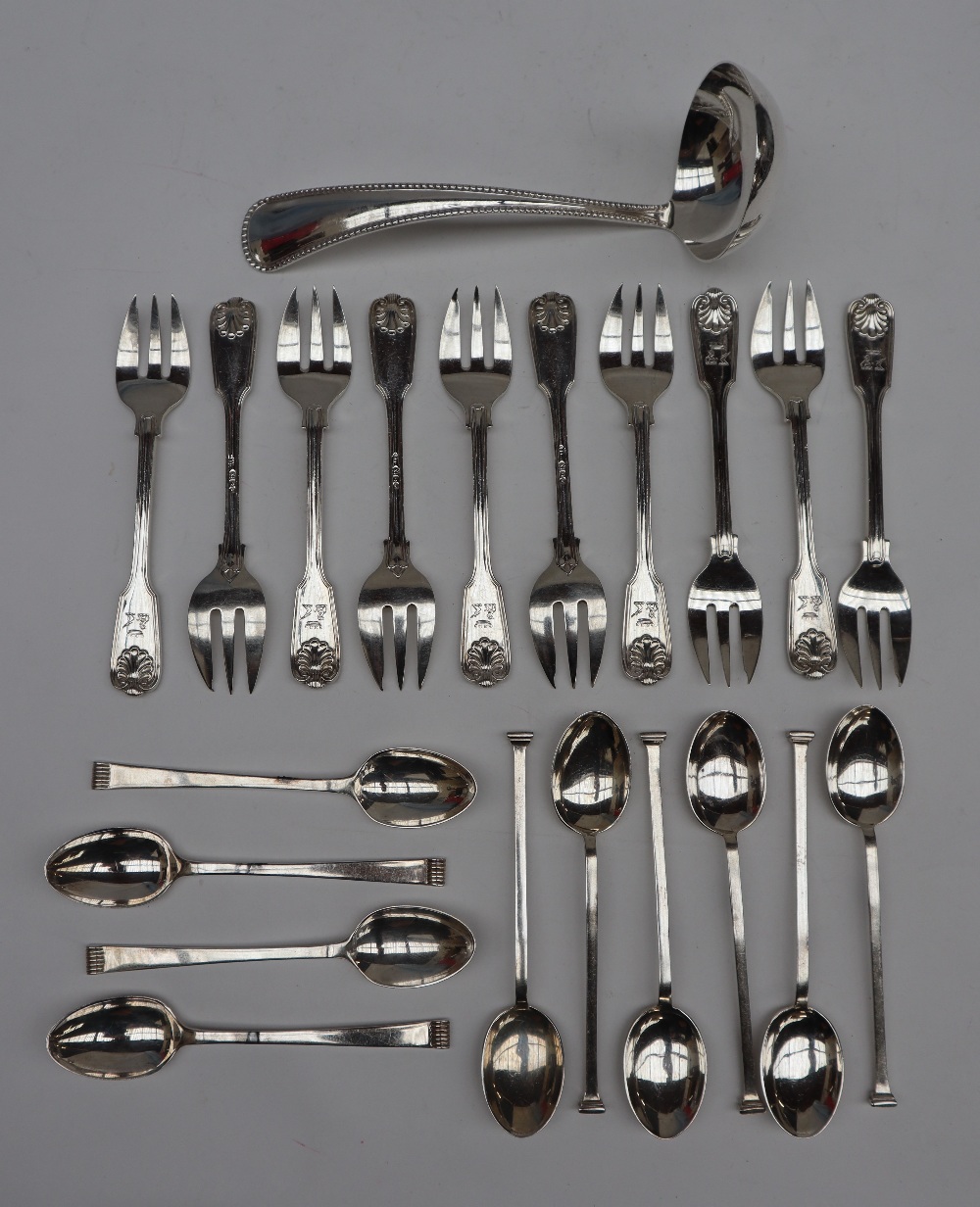 A set of ten George V silver fiddle shell and line decorated dessert forks, London, 1911,