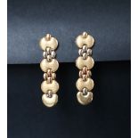 A pair of 18ct two tone gold drop earrings,