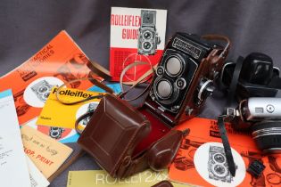 A Rolleiflex camera together with a Werra Matic camera and paperwork CONDITION REPORT: