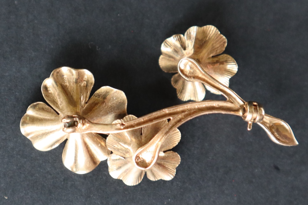 A 9ct gold brooch of floral form set with a garnet, - Image 4 of 4