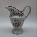 A Newhall porcelain milk jug of oval form and tapering body on a spreading foot painted with