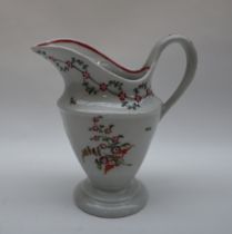 A Newhall porcelain milk jug of oval form and tapering body on a spreading foot painted with