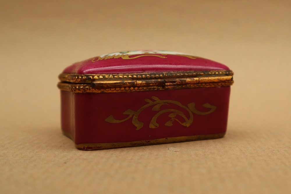 A 19th century porcelain box and cover painted with flowers to the lid and a rose pink border with - Image 4 of 7