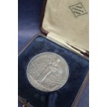 A Royal Agricultural Society of England white metal medallion,