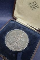 A Royal Agricultural Society of England white metal medallion,