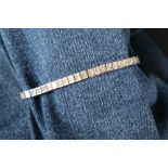 An 18ct white gold diamond set tennis bracelet,