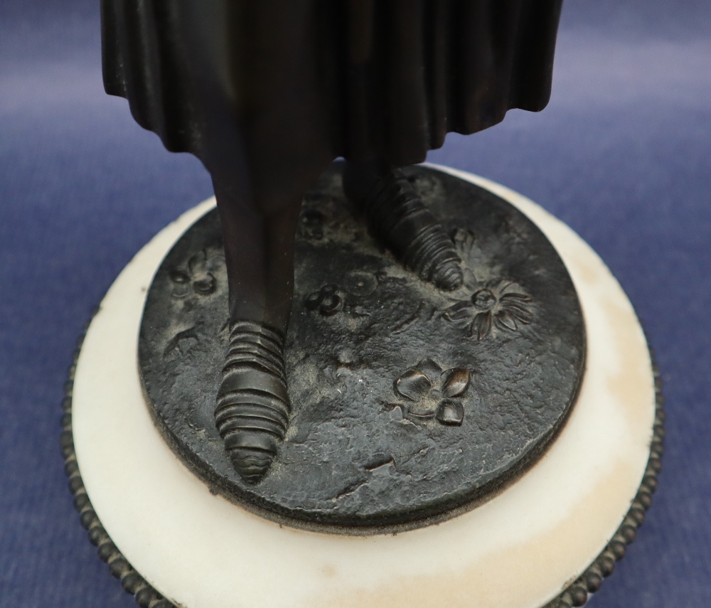 A bronze figure of Joan of Arc, with head bowed clutching a sword, on a circular marble base, 27. - Image 7 of 8