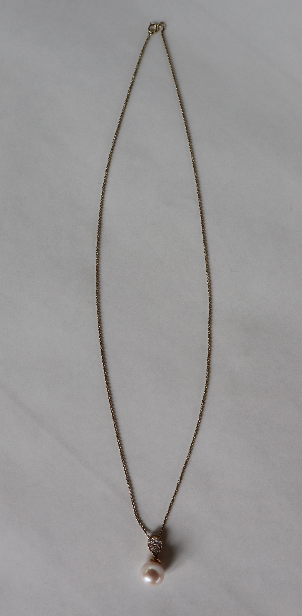 A 9ct yellow gold cultured pearl and diamond inverted pear-shape pendant and chain, - Image 6 of 6