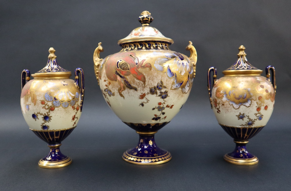 A Royal Crown Derby garniture of three vases with domed covers the body decorated with flower heads - Image 5 of 6