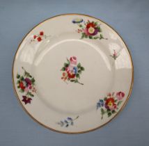 A Swansea porcelain dessert plate decorated with sprays of garden flowers to a gilt border,