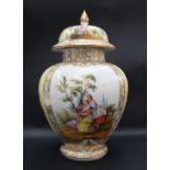 A 19th century porcelain vase and cover, the domed cover with a pointed gilt finial,