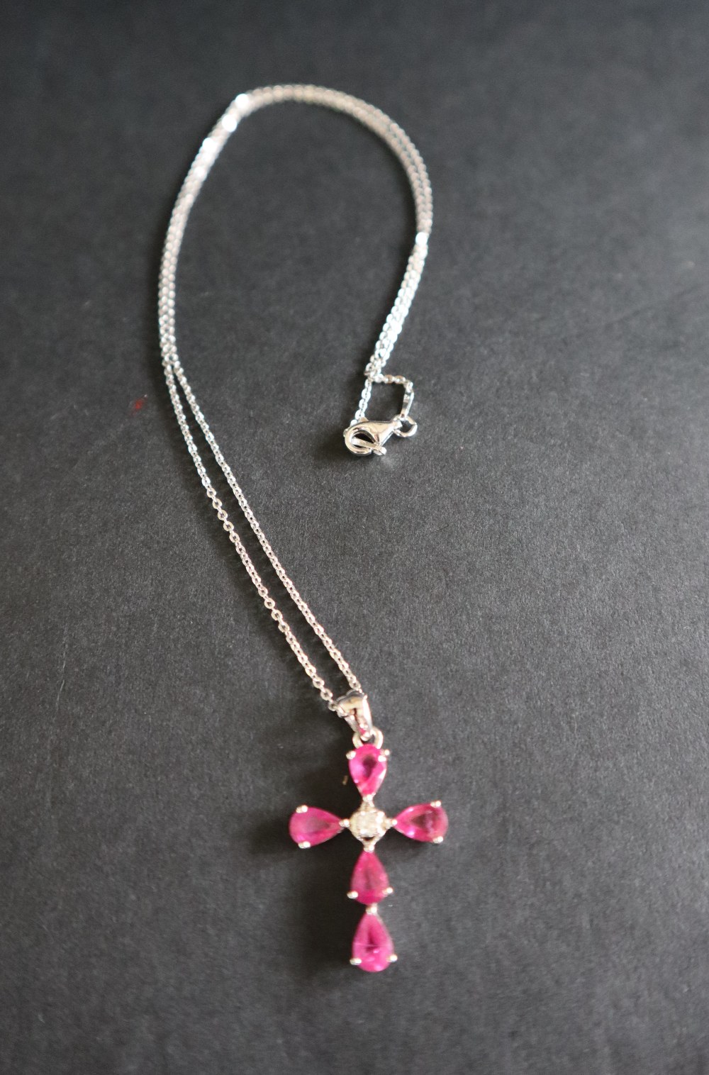 A 9ct white gold pear-shaped ruby and diamond cross on a silver chain - Image 5 of 6