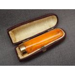 A 9ct gold mounted amber cheroot cigar holder,