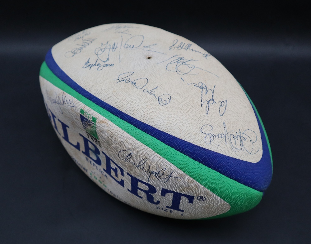 A 1999 Gilbert replica Rugby ball signed, including Chris Wyatt, Gareth Thomas, Gareth Jenkins,