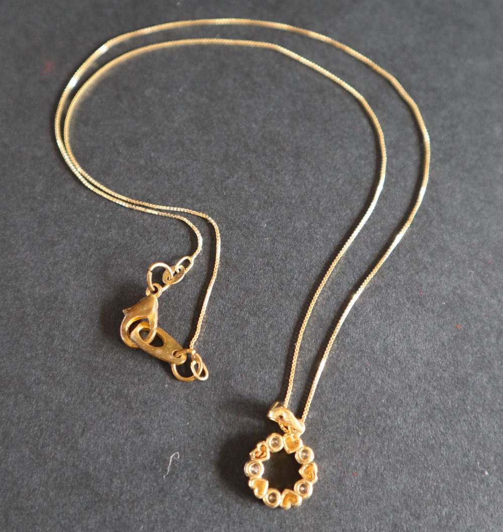 An 18ct yellow gold pendant of circular form, paste set, on an 18ct yellow gold chain, - Image 5 of 5