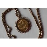 An Edward VII gold half sovereign dated 1902 in a 9ct gold slip mount on a 9ct gold chain,